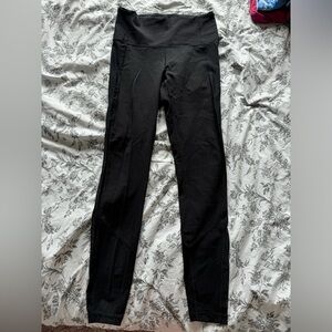 Black lululemon leggings with black and dot mesh details